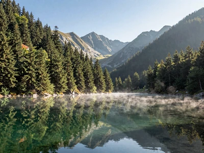 Durmitor National Park with Black Lake reflecting mountain peaks in morning mist
