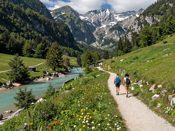 Couple hiking in the Julian Alps near Soča River in Slovenia, representing the outdoor lifestyle of Slovenian women dating