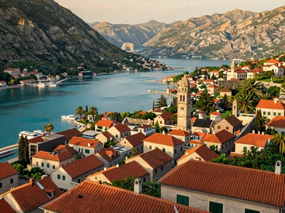 Kotor Old Town aerial view with terracotta roofs and Bay of Kotor surrounded by mountains